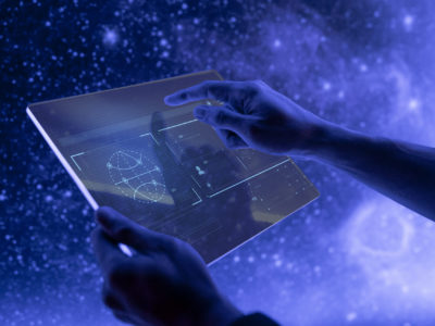 Researcher using a transparent digital tablet screen futuristic technology